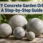 Various concrete garden orbs displayed in an outdoor setting.