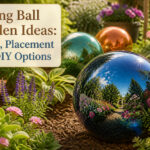 A colorful gazing ball in a garden reflecting plants and sunlight.