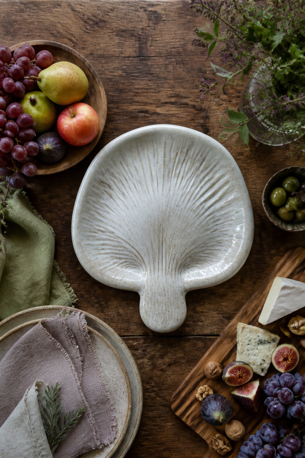 A large mushroom-shaped ceramic platter on a table.