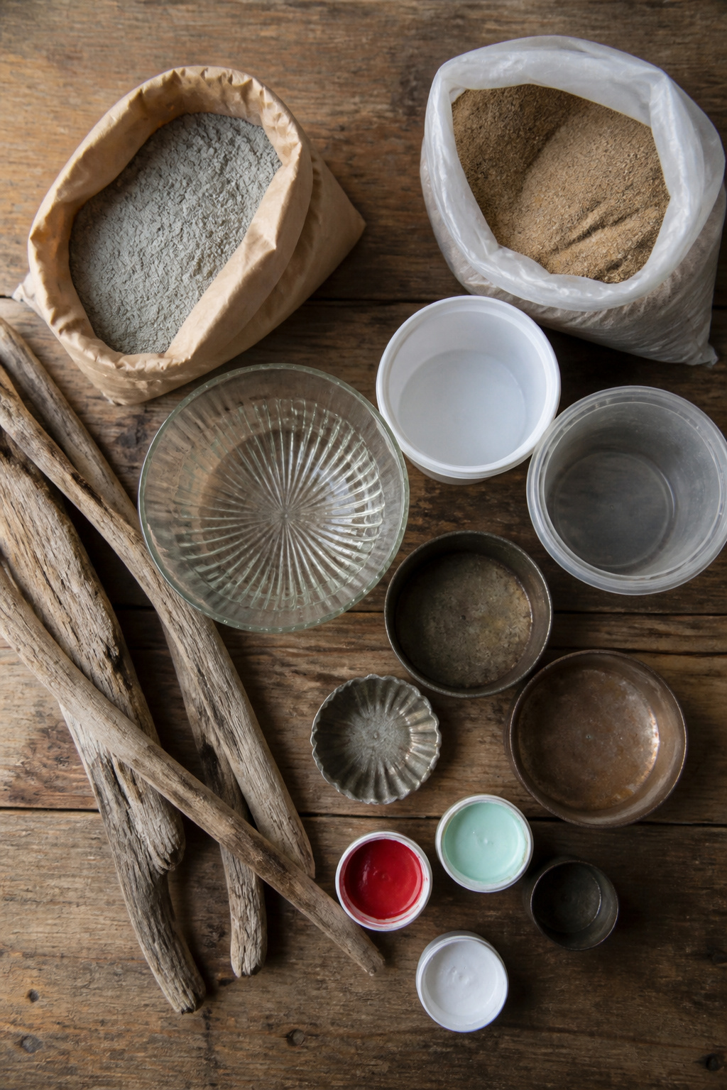 Supplies for creating DIY mushroom garden decor, including cement and molds.